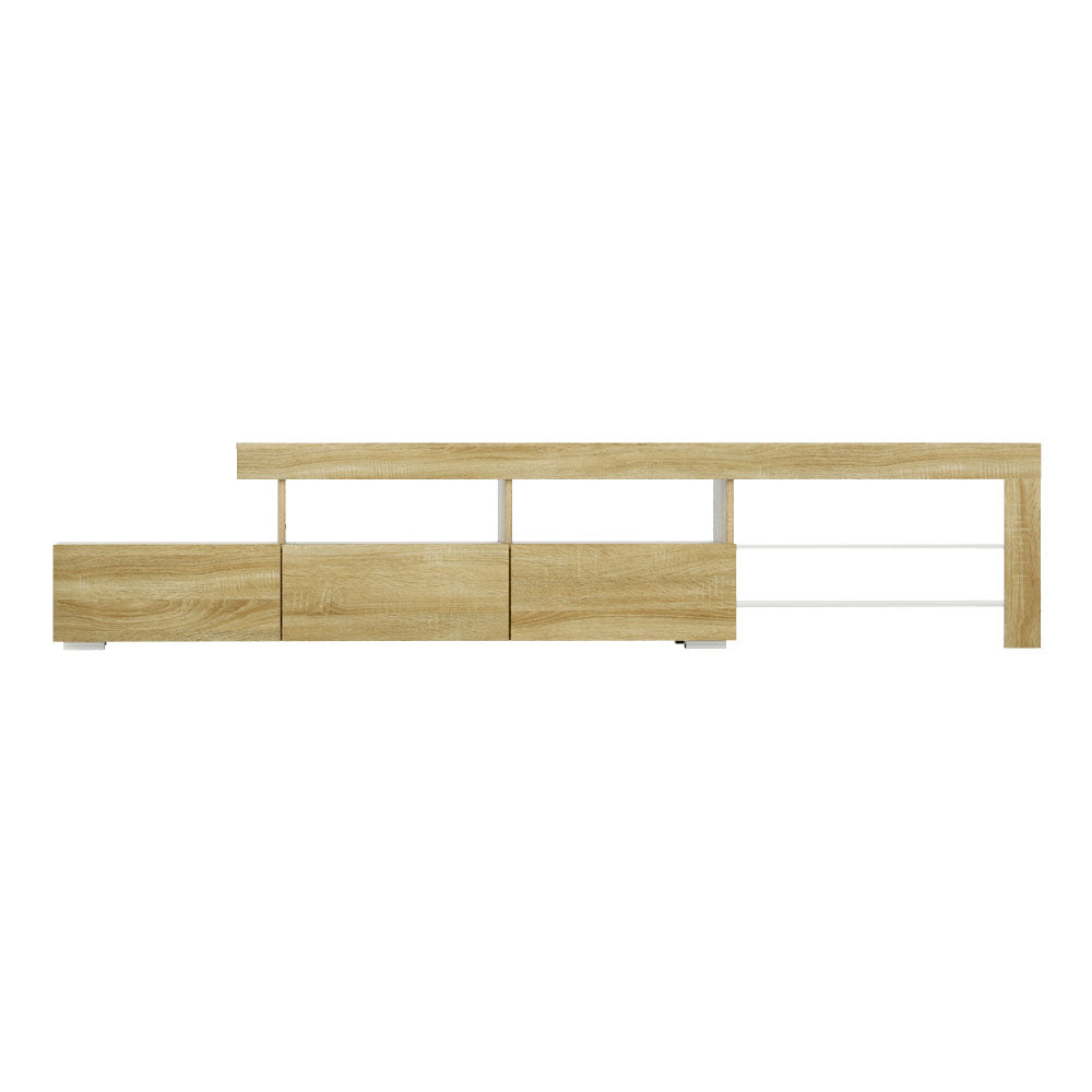 Penguin 215cm pine LED entertainment unit with colour changing lighting and glass shelves in a modern living room