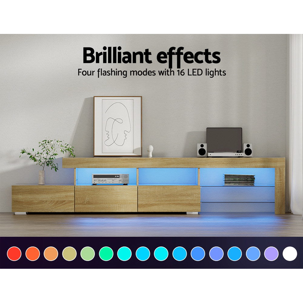 Penguin 215cm pine LED entertainment unit with colour changing lighting and glass shelves in a modern living room