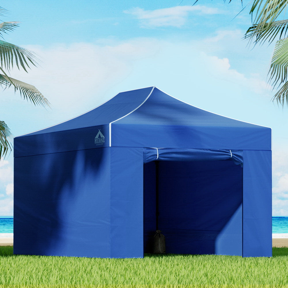 Blue 3 x 4.5 m pop up gazebo erected outdoors with steel frame and canopy