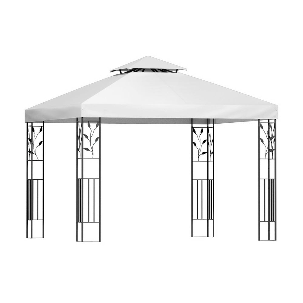 White iron art gazebo shading an outdoor wedding and dining setting