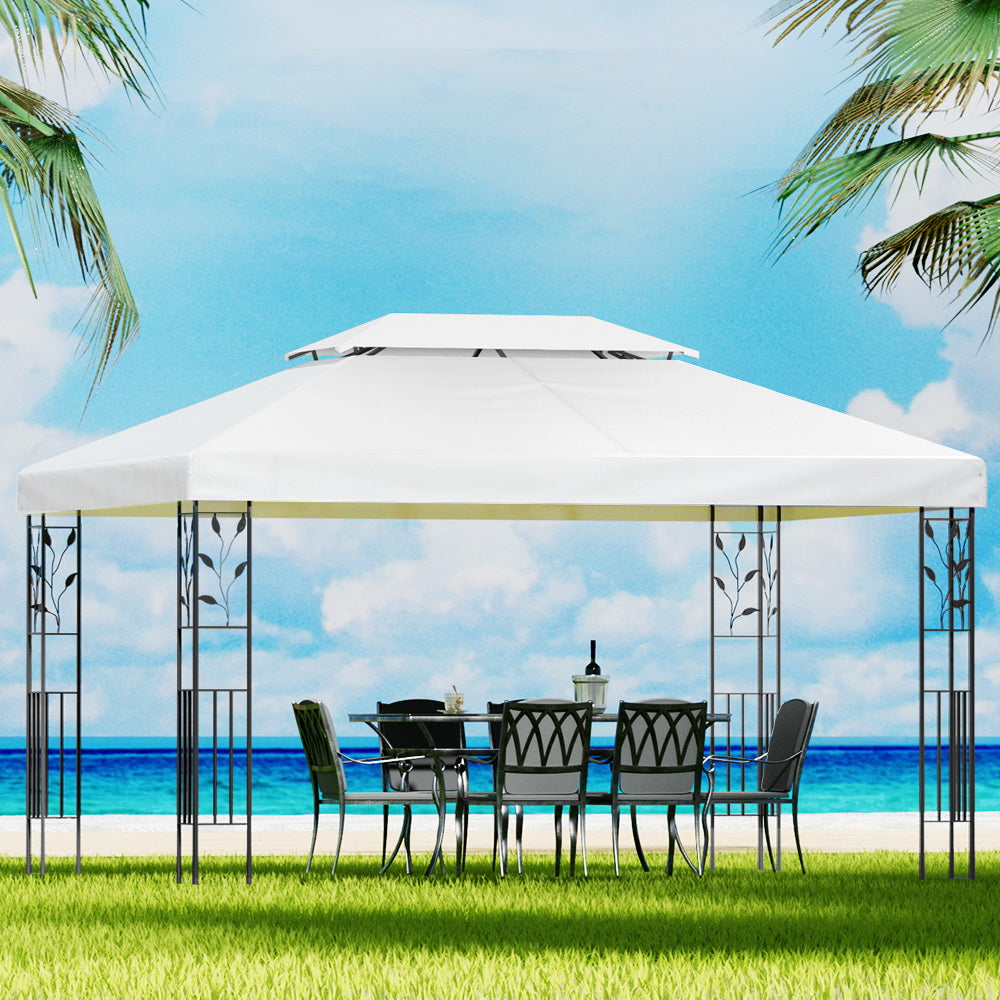 White 4 x 3 m iron art gazebo with ornate steel frame in a garden