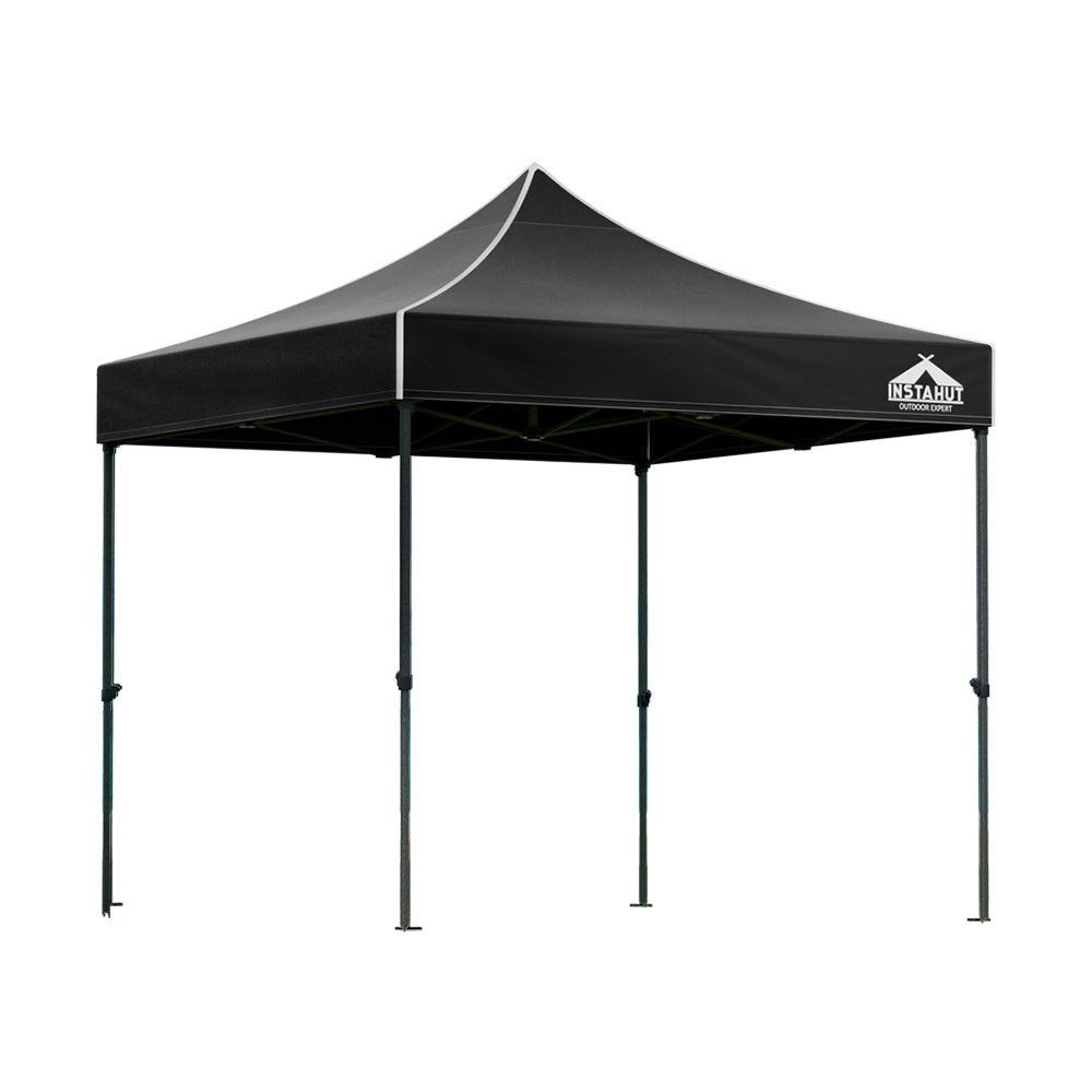 Black pop up gazebo shown providing shade at an outdoor event