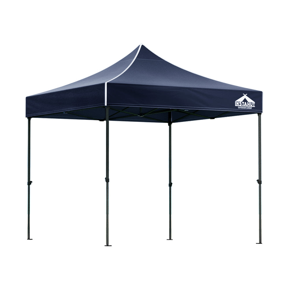 Navy pop up gazebo shown providing shade at an outdoor event