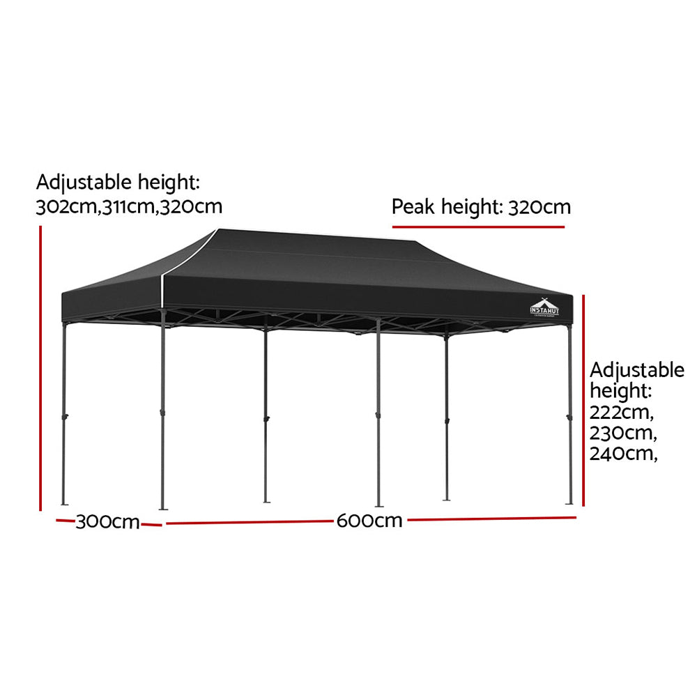 Long black folding marquee tent shown from the side with its peaked canopy