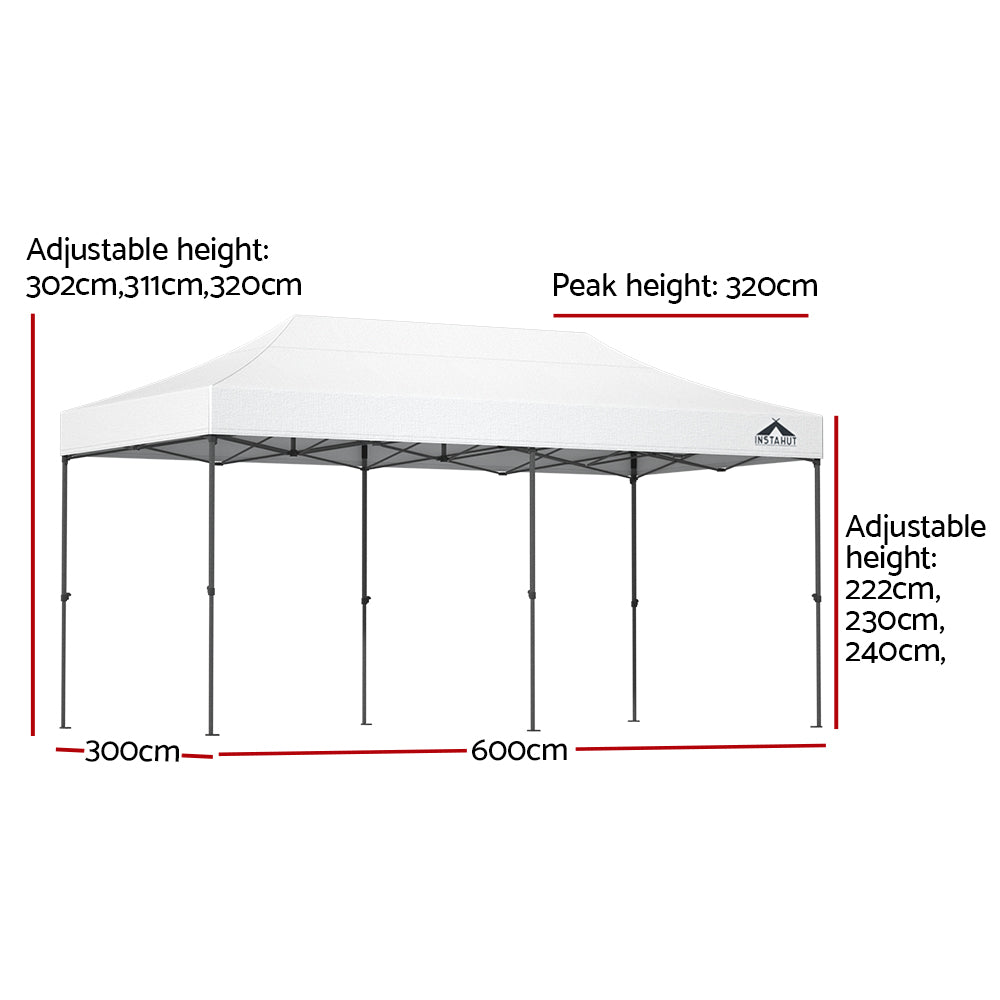 Long white folding marquee tent shown from the side with its peaked canopy