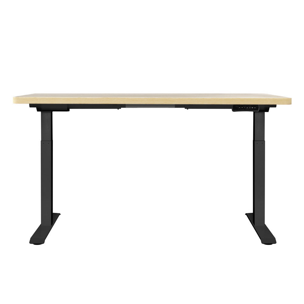 Manuka oak electric standing desk with black frame in a home office