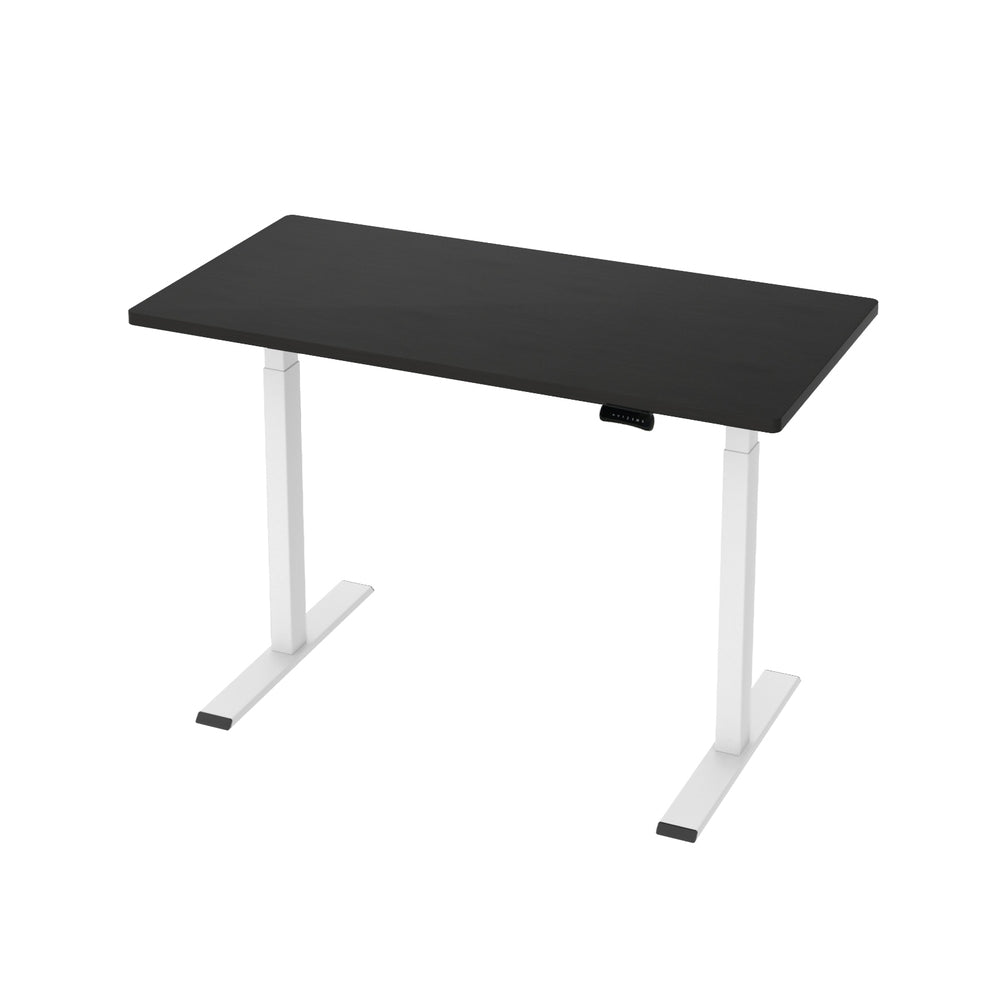 Manuka black electric standing desk with white frame in a home office