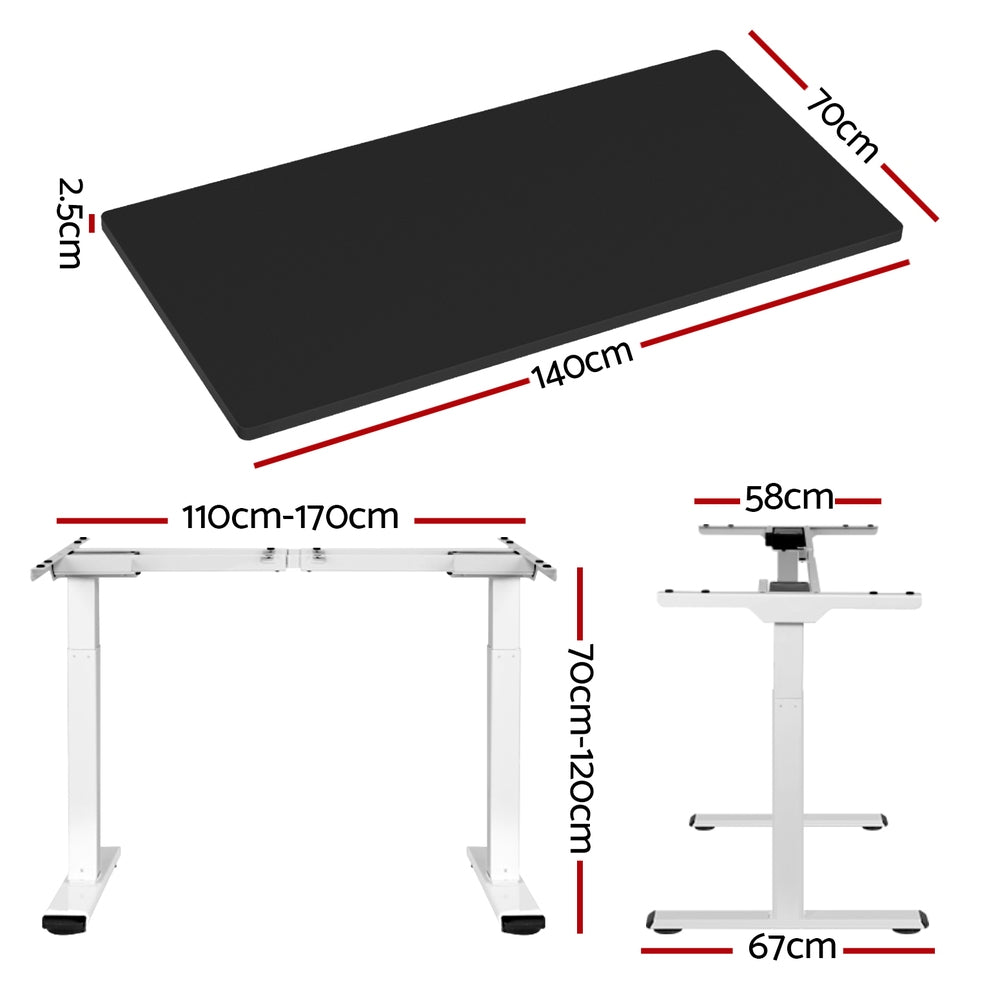 Manuka black electric standing desk with white frame in a home office