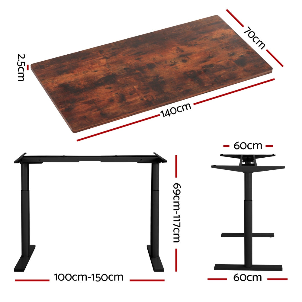Braddon rustic brown electric standing desk with black frame in a home office