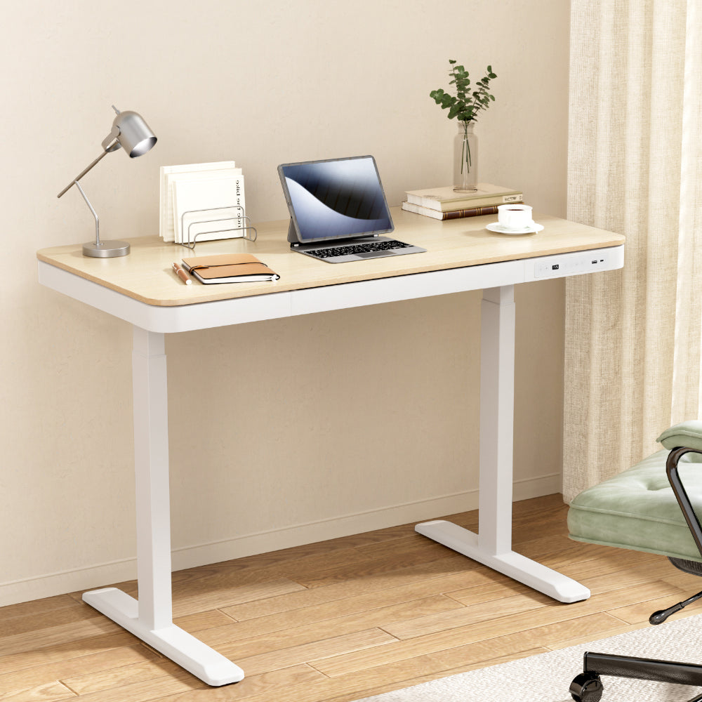 Barton oak electric standing desk with drawer in a home office
