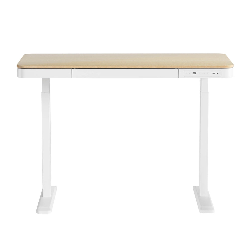 Barton oak electric standing desk with drawer in a home office