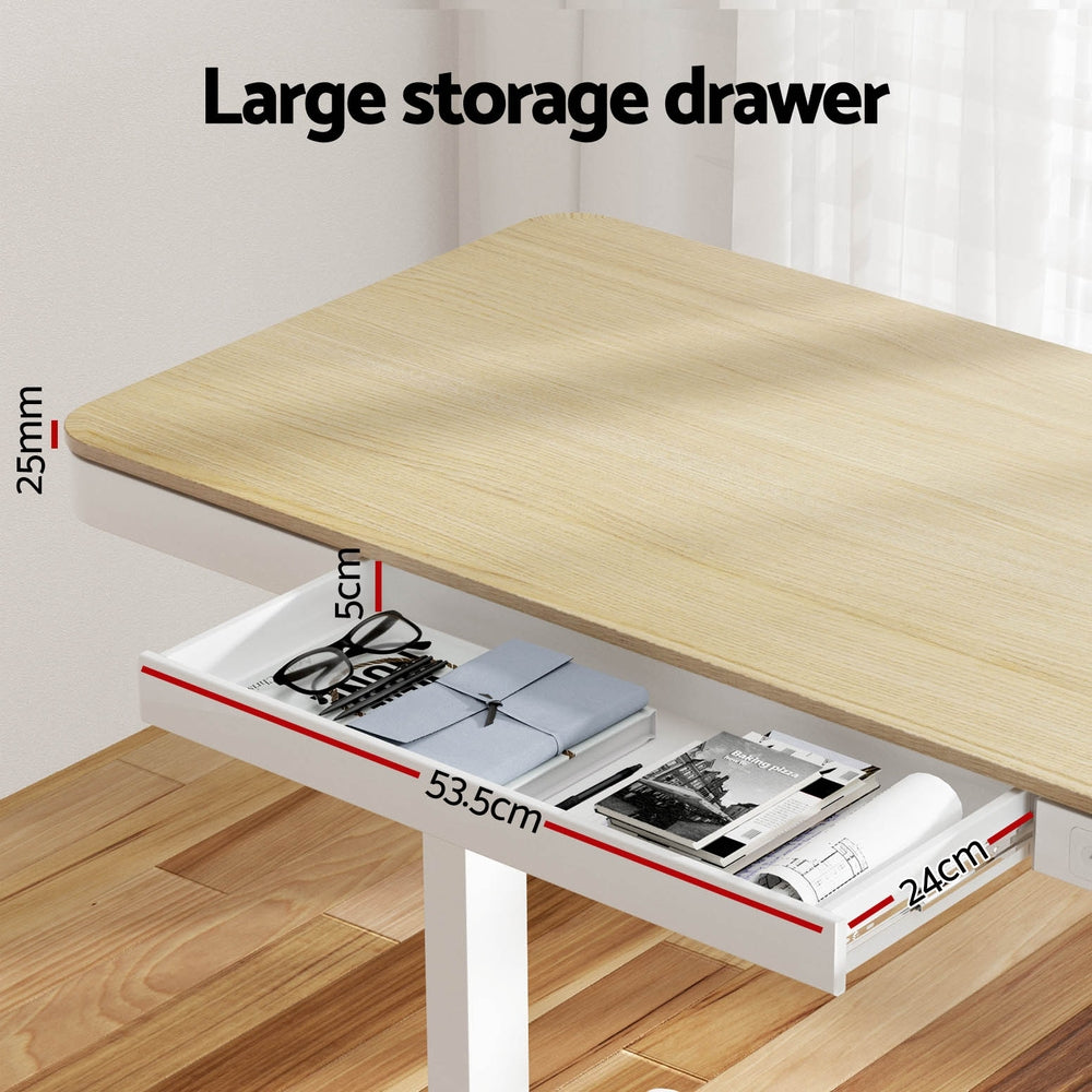 Barton oak electric standing desk with drawer in a home office