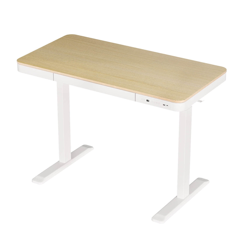 Barton oak electric standing desk with drawer in a home office