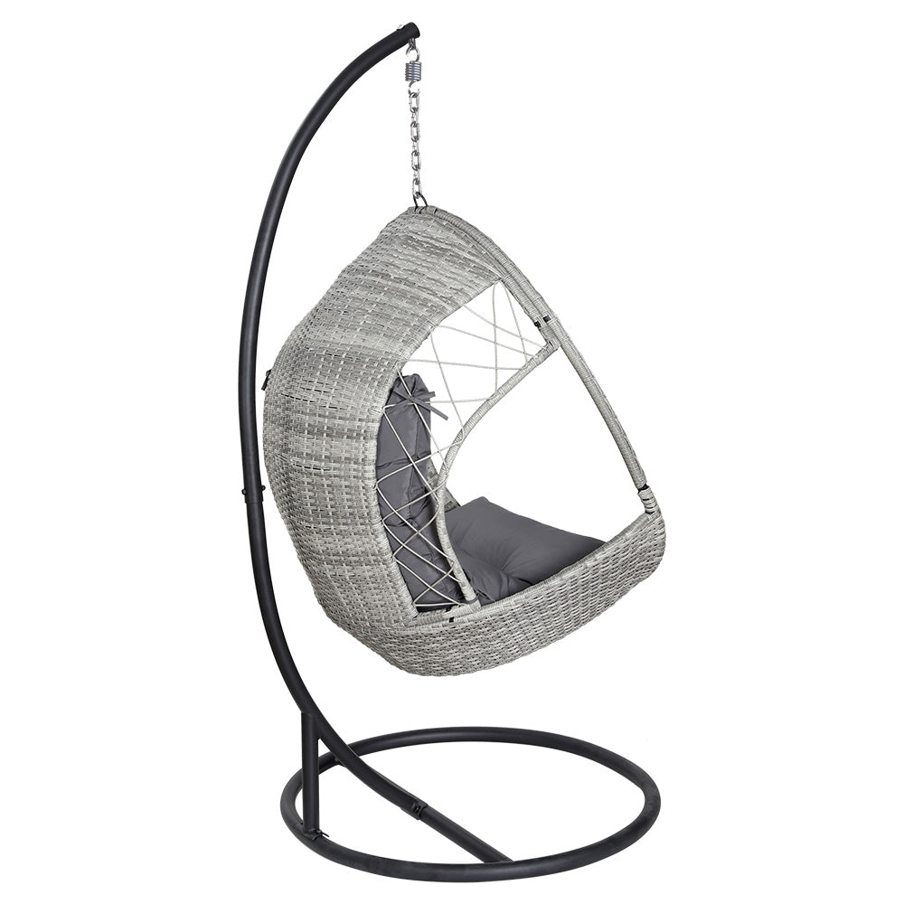 Gerroa light grey resin wicker hanging egg chair with stand on a patio