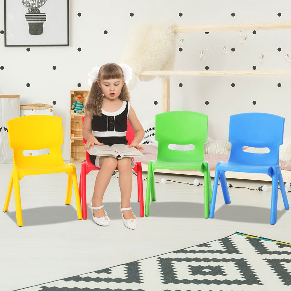 Set of four kids plastic chairs in yellow, red, green and blue