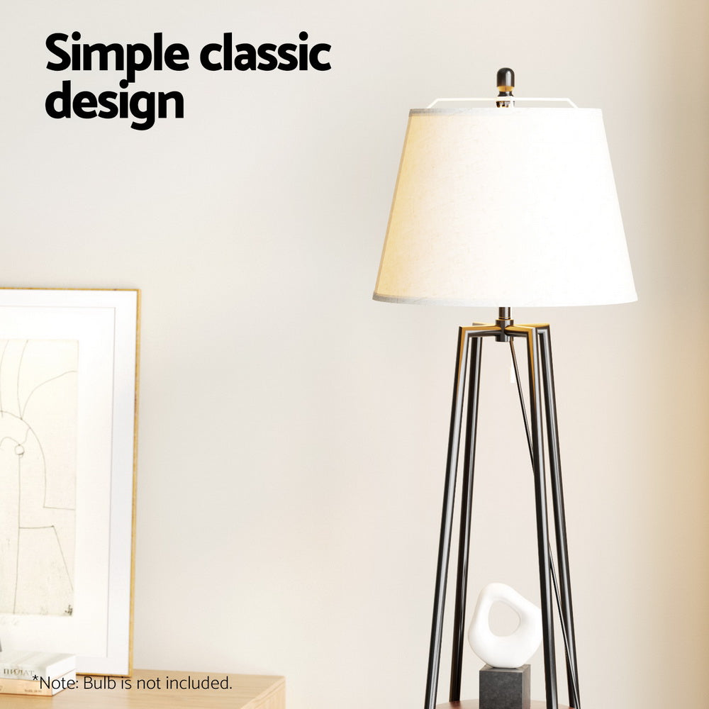 Black floor lamp with storage shelves and linen shade