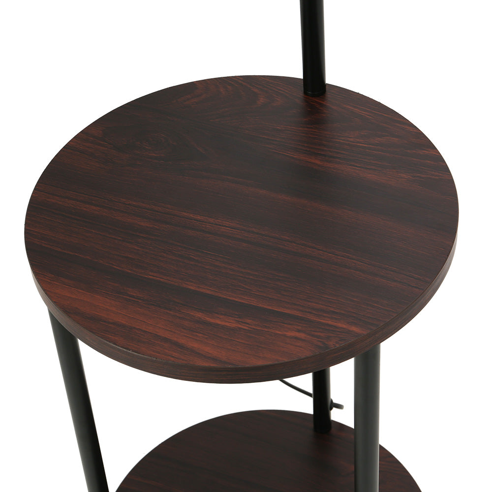 Black and walnut floor lamp with storage shelves and adjustable head