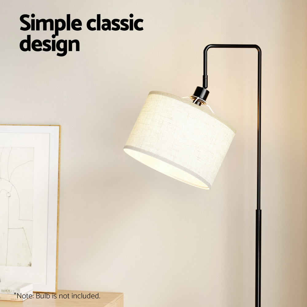 Black and walnut floor lamp with storage shelves and adjustable head
