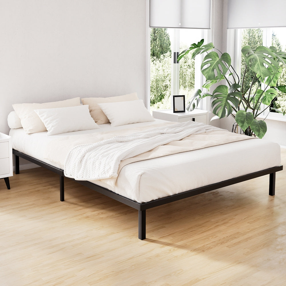 Acqui Black Queen bed frame in a modern bedroom