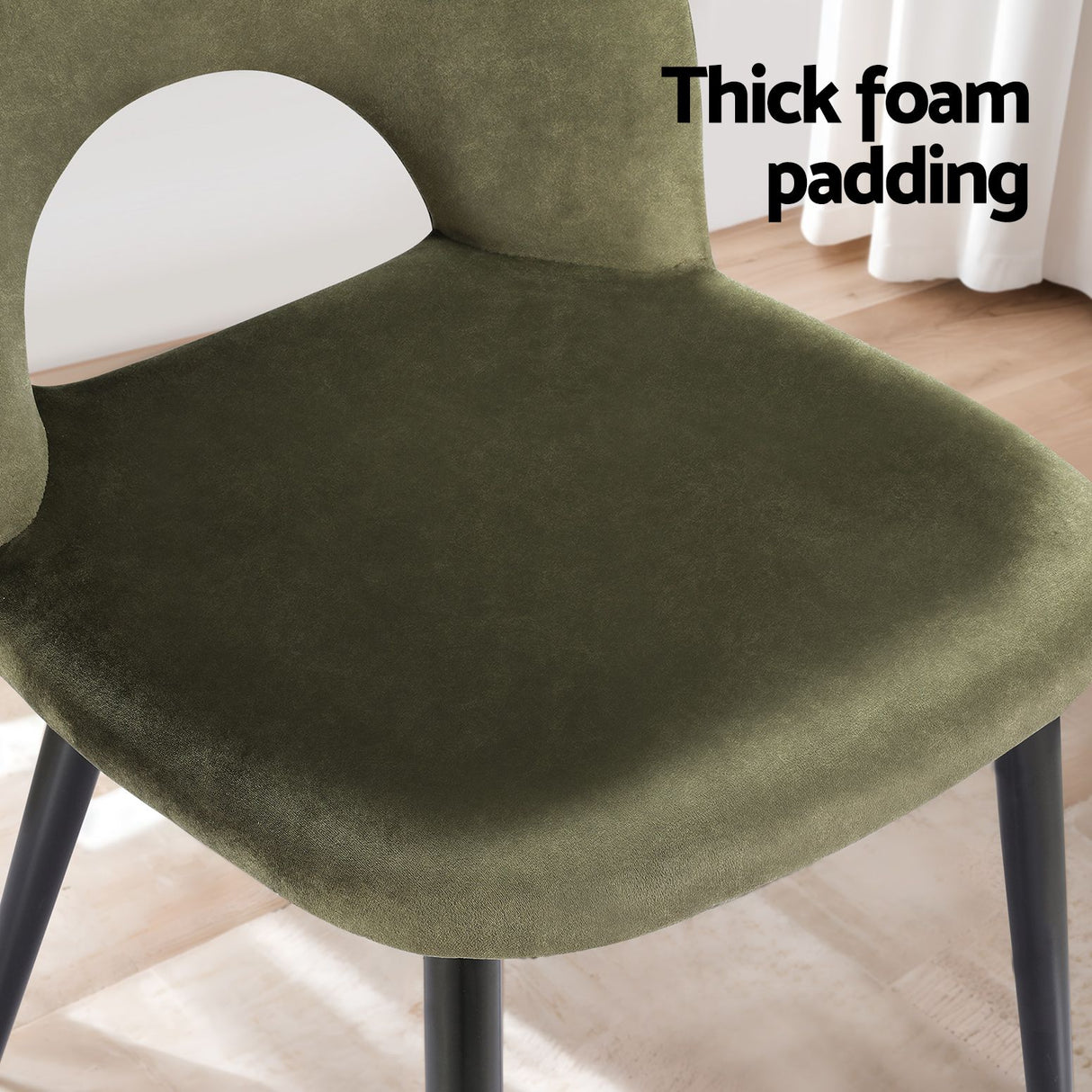 Ebenezer green velvet dining chair in a modern dining room