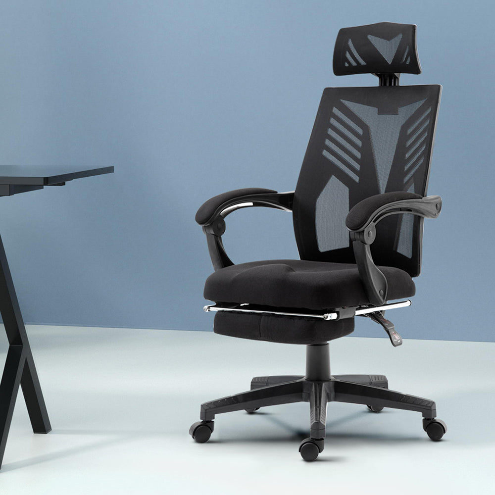 Claremont black high back mesh reclining office chair with footrest in a home office