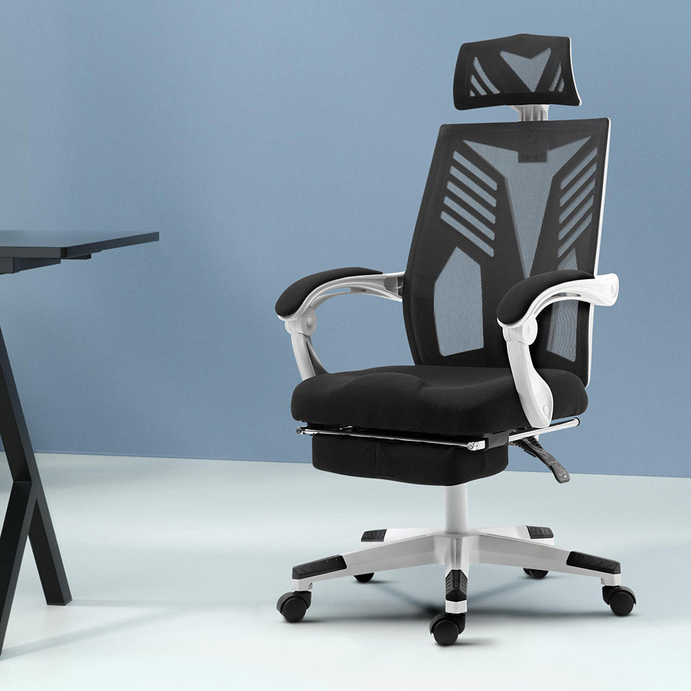 Claremont black and white high back mesh reclining office chair with footrest in a home office