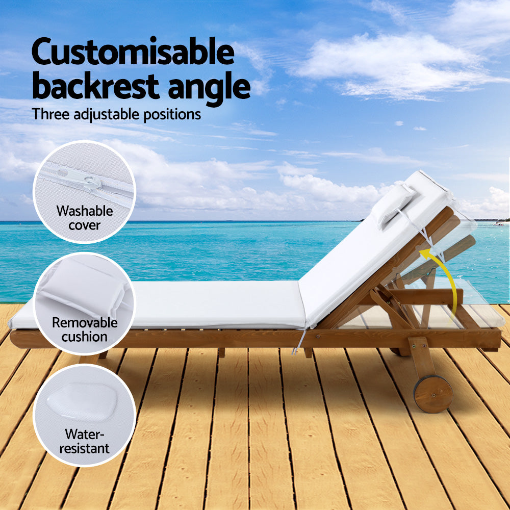Gerringong natural wood sun lounger with white cushion and wheels on a patio