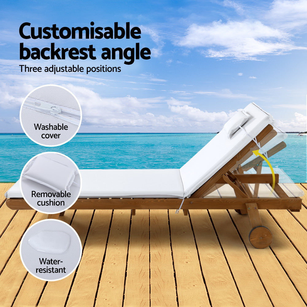Gerringong natural wood sun lounger with white cushion and wheels on a patio