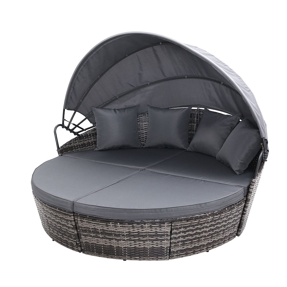Palm Beach grey wicker outdoor daybed in an outdoor setting