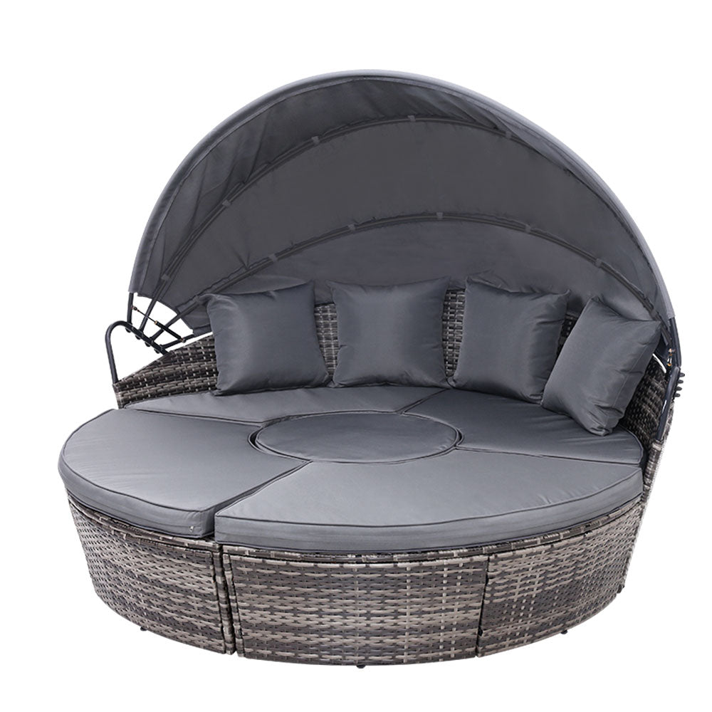 Palm Beach grey wicker outdoor daybed in an outdoor setting