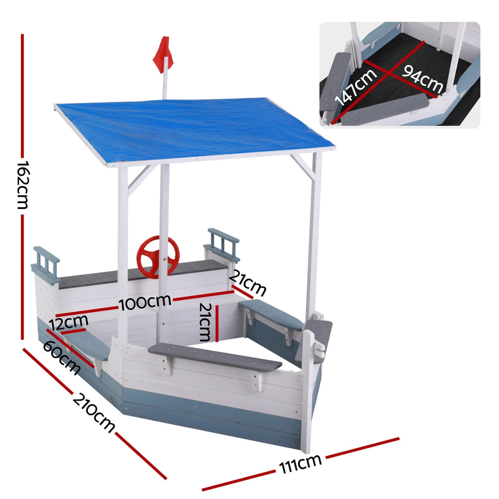Wooden boat sandpit with canopy and flag in blue