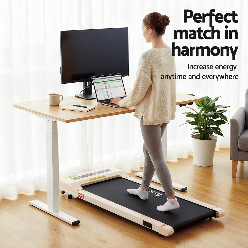 Kingston oak electric standing desk with walking pad in a home office