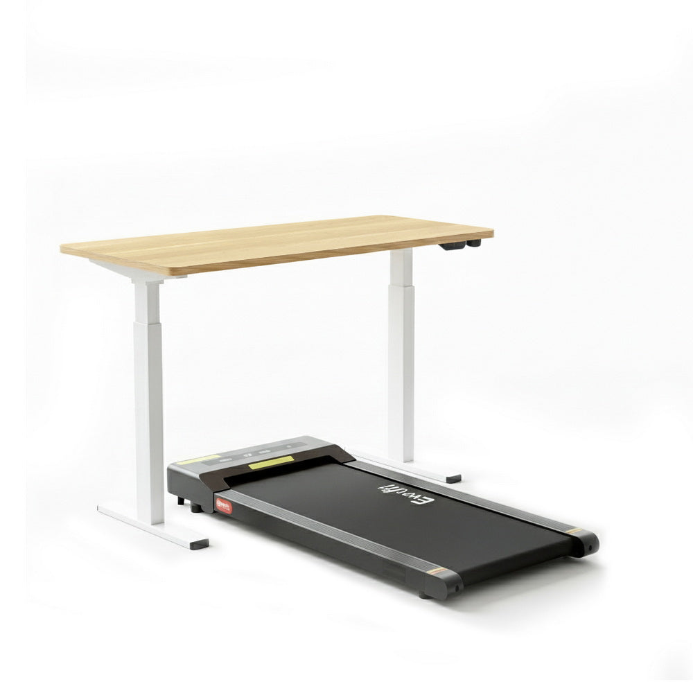 Kingston oak electric standing desk with walking pad in a home office