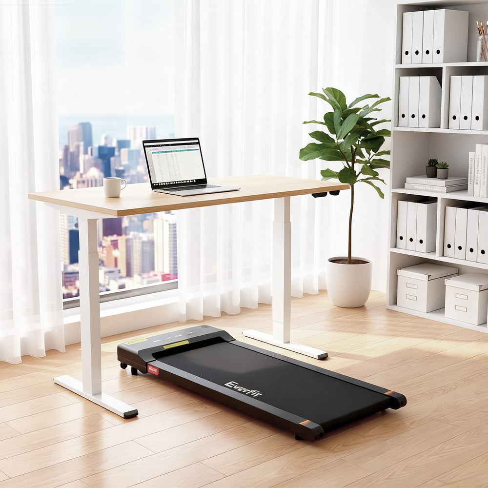 Kingston oak electric standing desk with walking pad in a home office