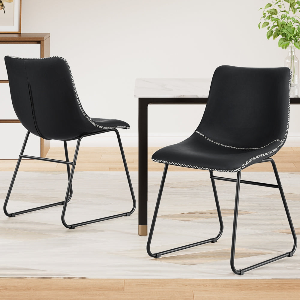 Daveyston black faux leather dining chair with metal sled legs