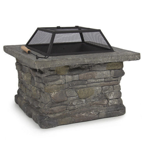 Victor Harbor faux stone fire pit table with iron bowl and BBQ grill on a patio