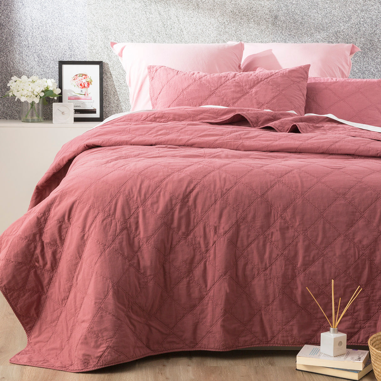 Foxcote rose stonewash cotton quilted coverlet set with two pillowcases on a bed