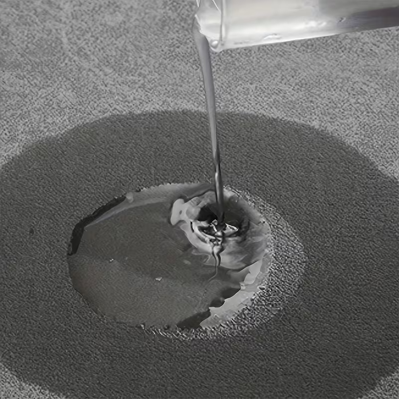 Light grey bath mat in use beside a shower, keeping the floor dry