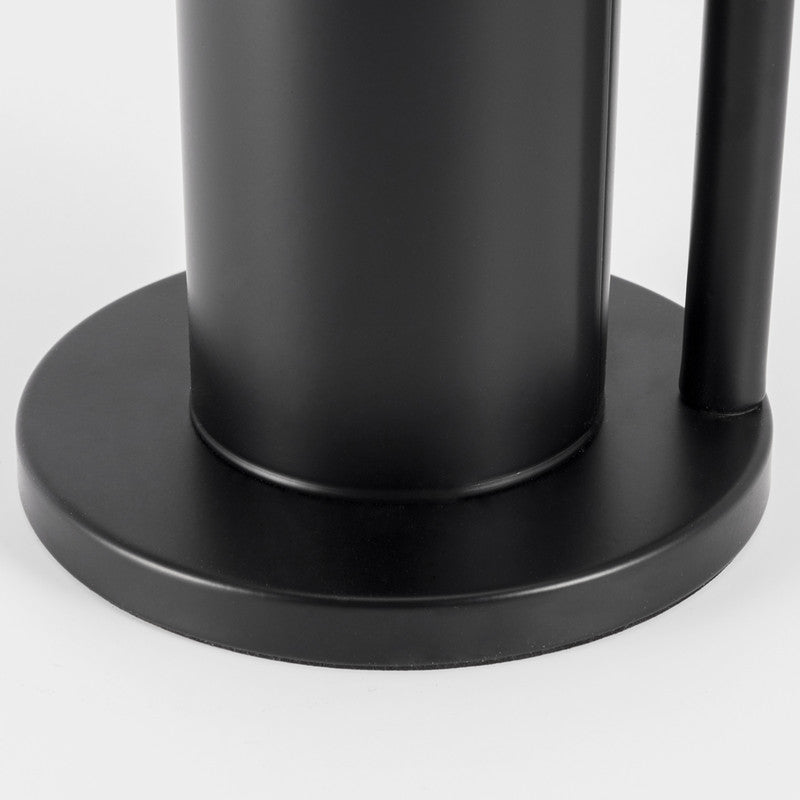 Black toilet roll rack in a bathroom setting with rolls stacked vertically