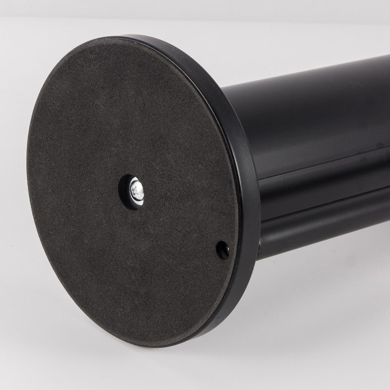 Toilet roll being pulled from the upright rack of the black freestanding stand