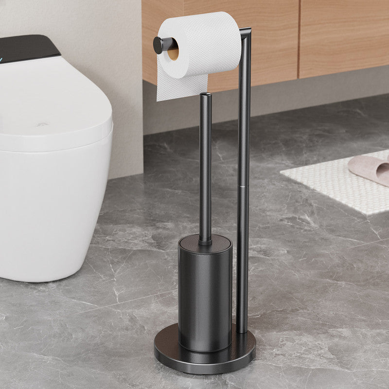 Upright black metal rack holding spare toilet rolls with the brush holder on the side