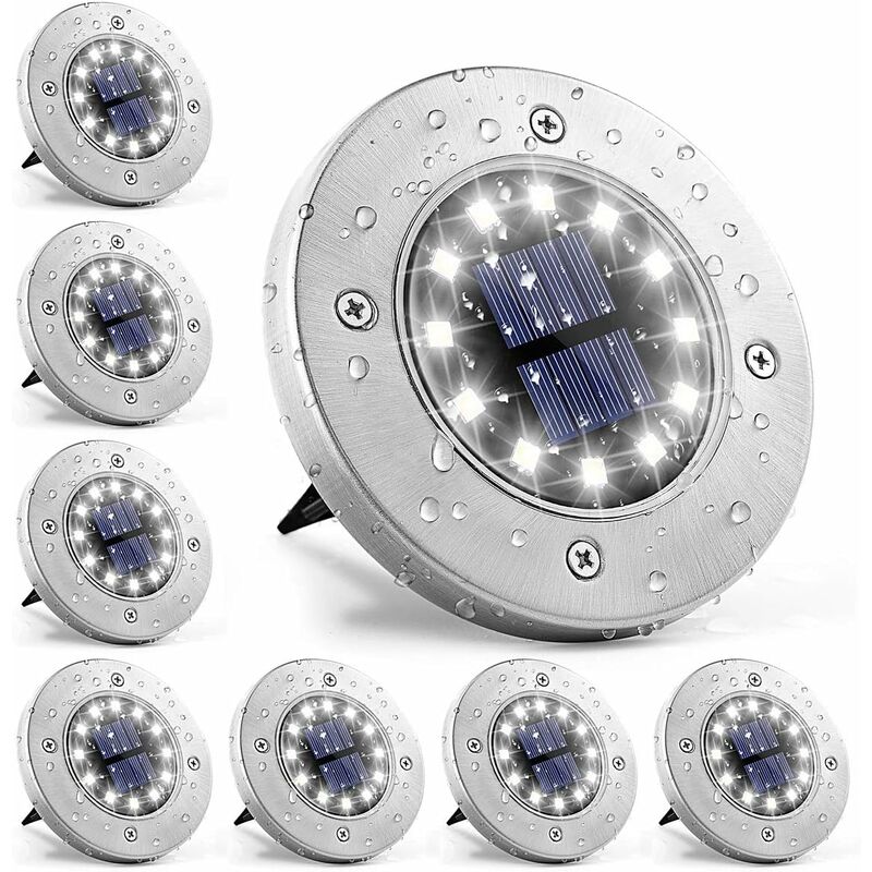 Stainless steel solar ground light with white LEDs in a garden