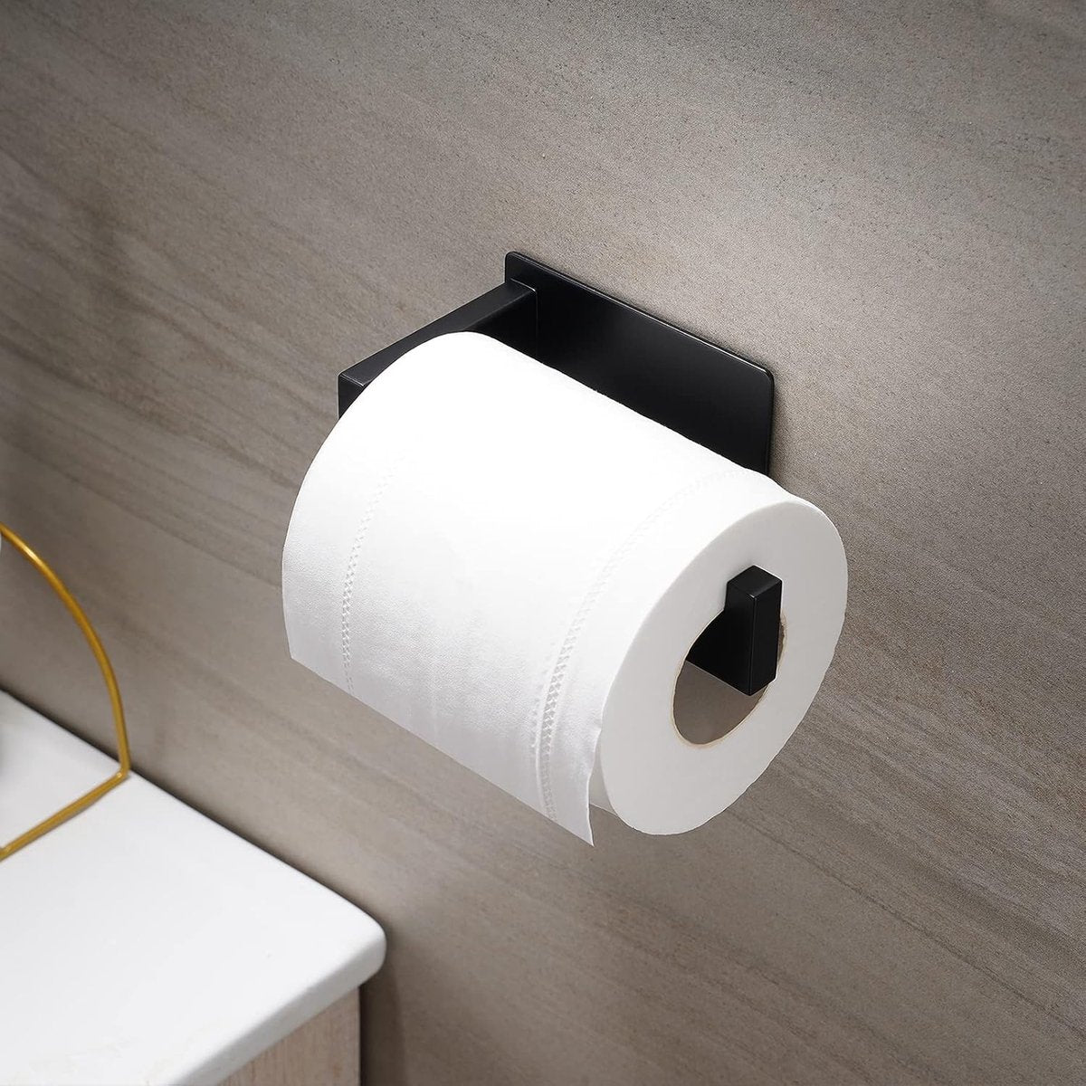 Toilet roll loaded on the compact black stainless steel holder