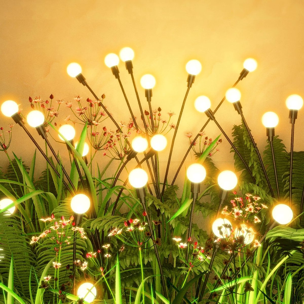 Warm white solar firefly lights swaying across a garden border at night