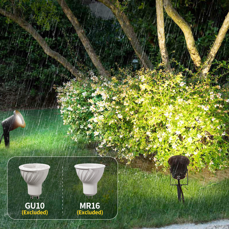 5W LED outdoor spotlight with white beam uplighting a garden
