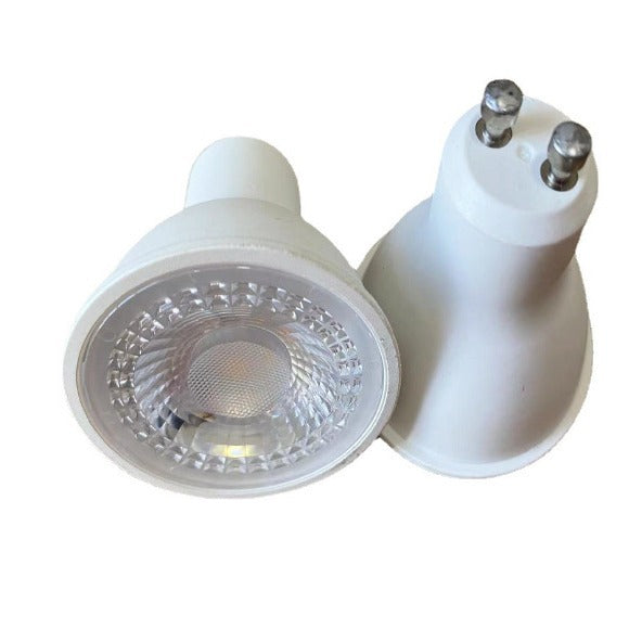 5W LED outdoor spotlight with white beam uplighting a garden