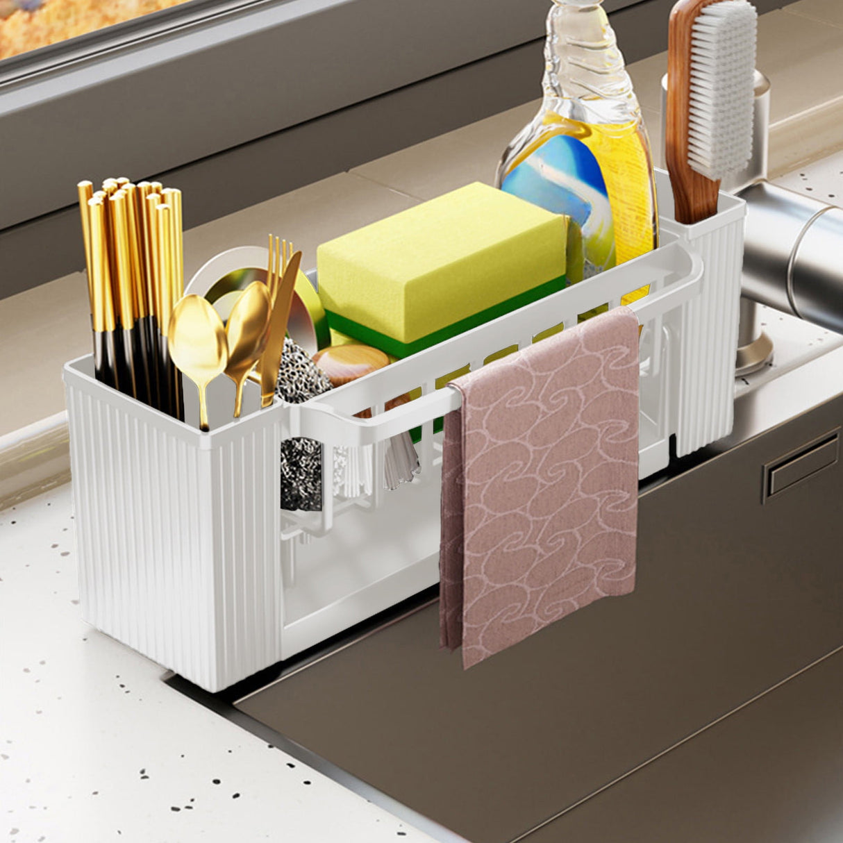 Beige sponge rack in use on a kitchen benchtop beside the tap
