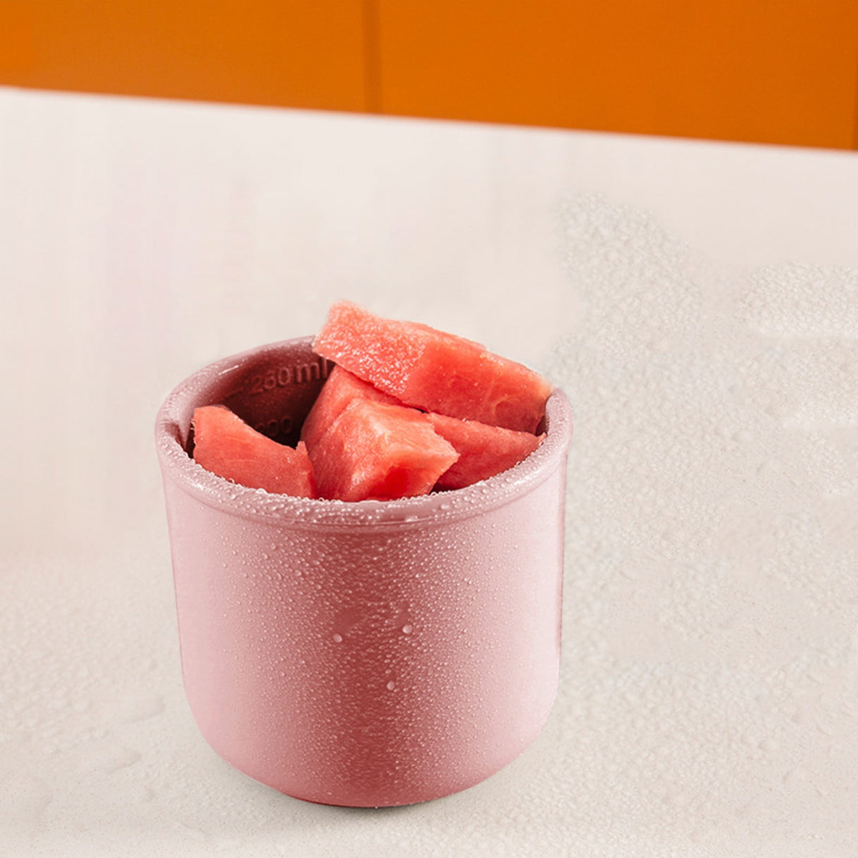 Pink reusable silicone baby snack container with lid