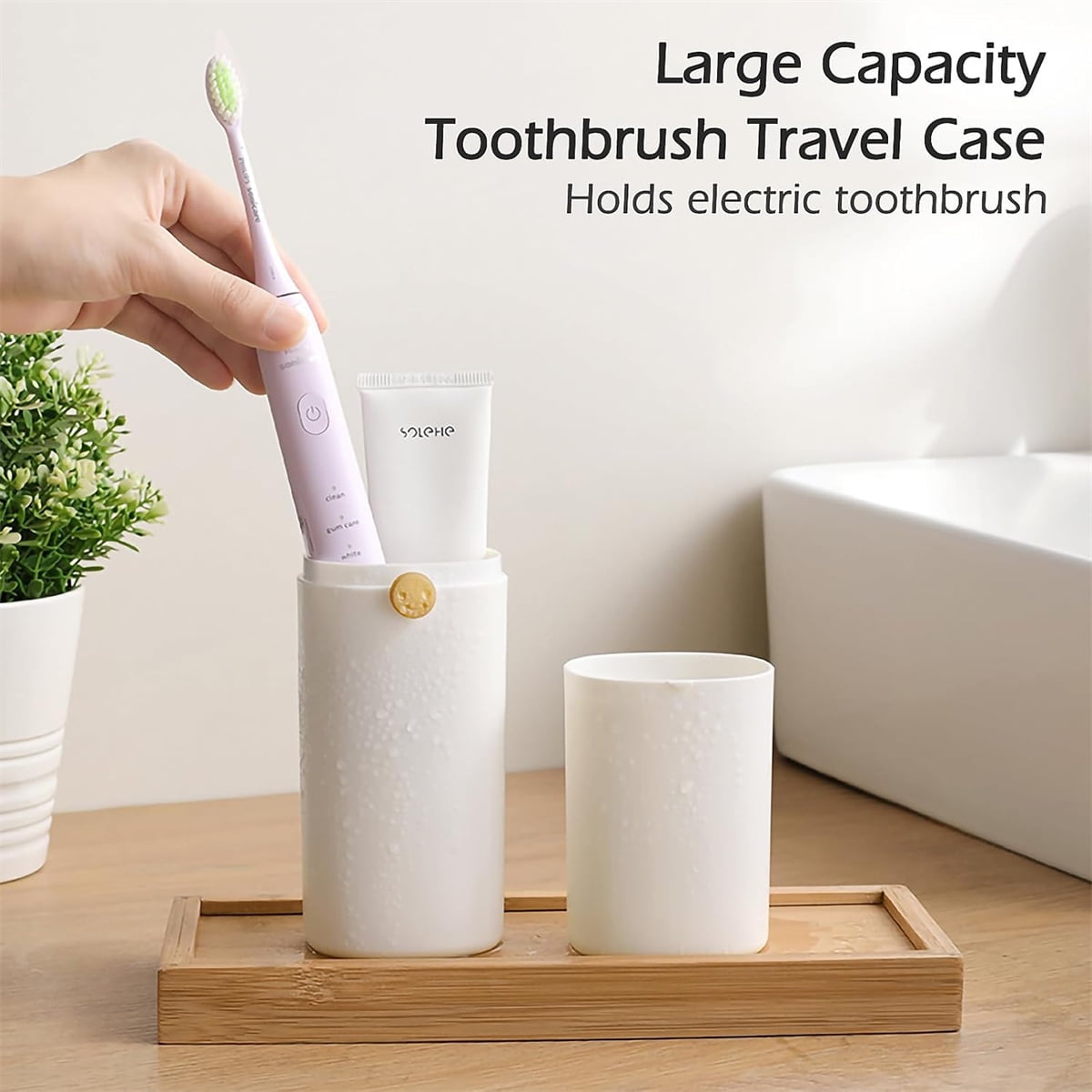 White travel toothbrush case packed in a toiletry bag for travel
