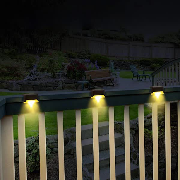 Solar LED outdoor lights in black with warm white glow - view 2